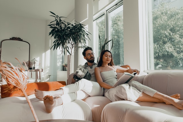 Couple relaxing at home on couch