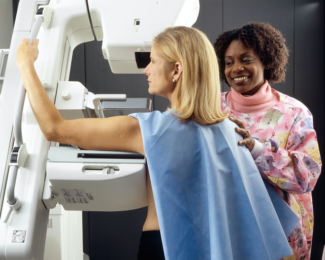 Woman Receives Mammogram